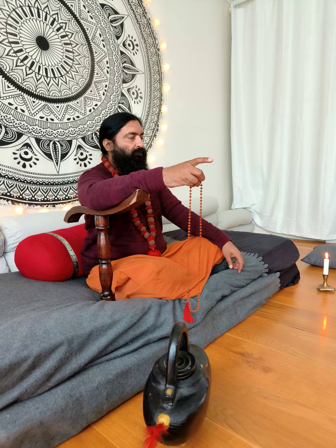 A live satsang with Swami Aditya: a small room of people sitting together in attention
