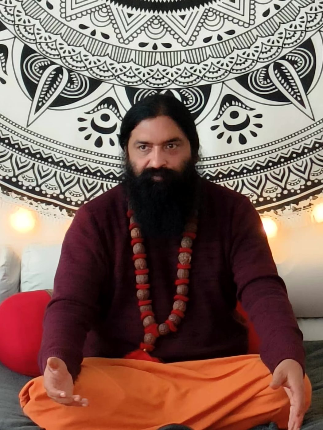 Swami Aditya seated in welcome, ready for a one-to-one conversation